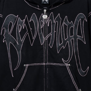 Close up of a black zip hoodie with black embroidered Revenge arch logo with pink contrast stitch outline embroidery