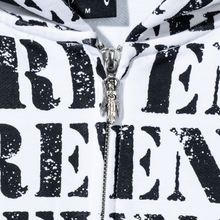Load image into Gallery viewer, Close up of a white zip hoodie with repeating REVENGE! in black distressed print and silver angel zipper puller
